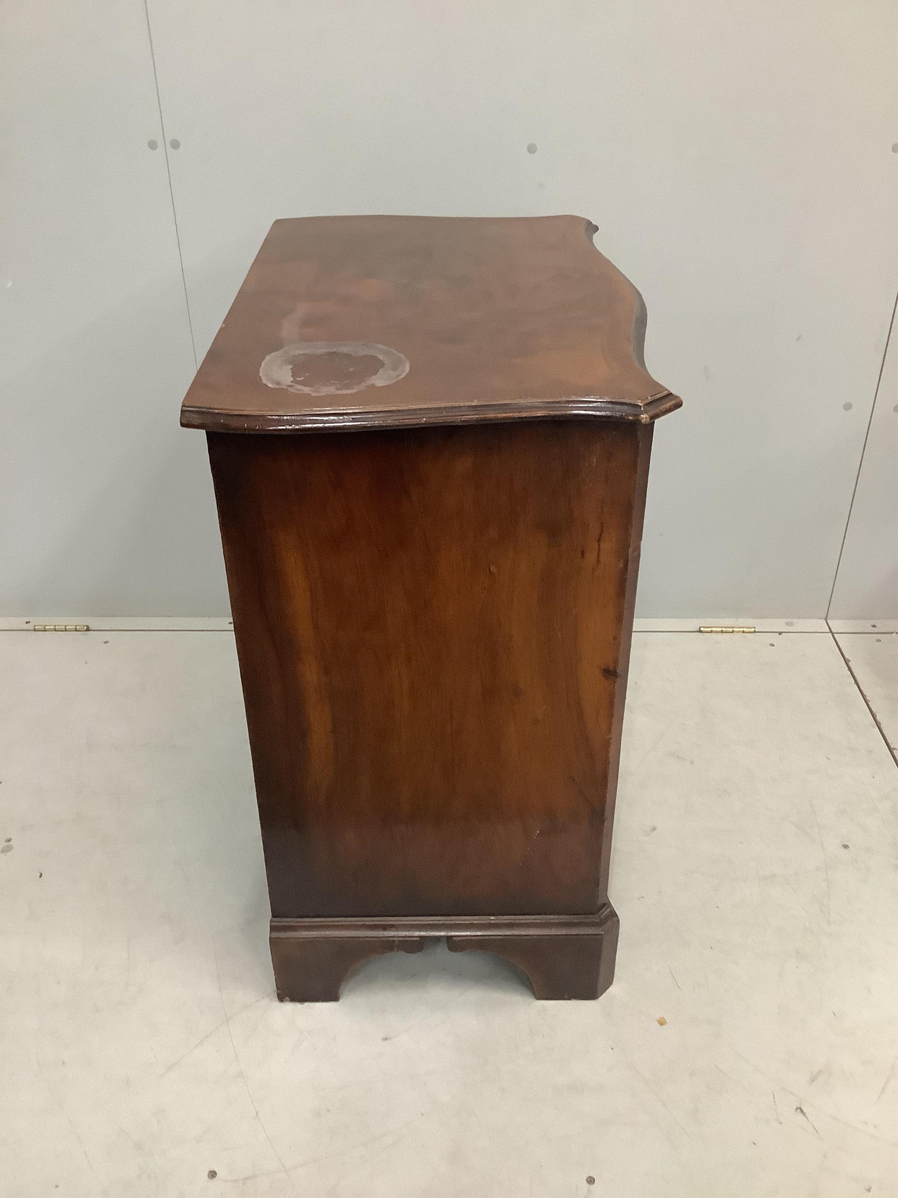 An early 20th century George I style banded walnut serpentine chest of drawers, width 73cm, depth 47cm, height 85cm